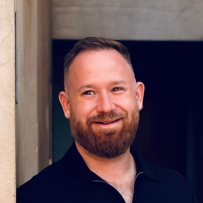 Dom Kozak, smiling, head and shoulders